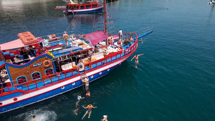 Sunset cruise in Greece with island beaches and sea views