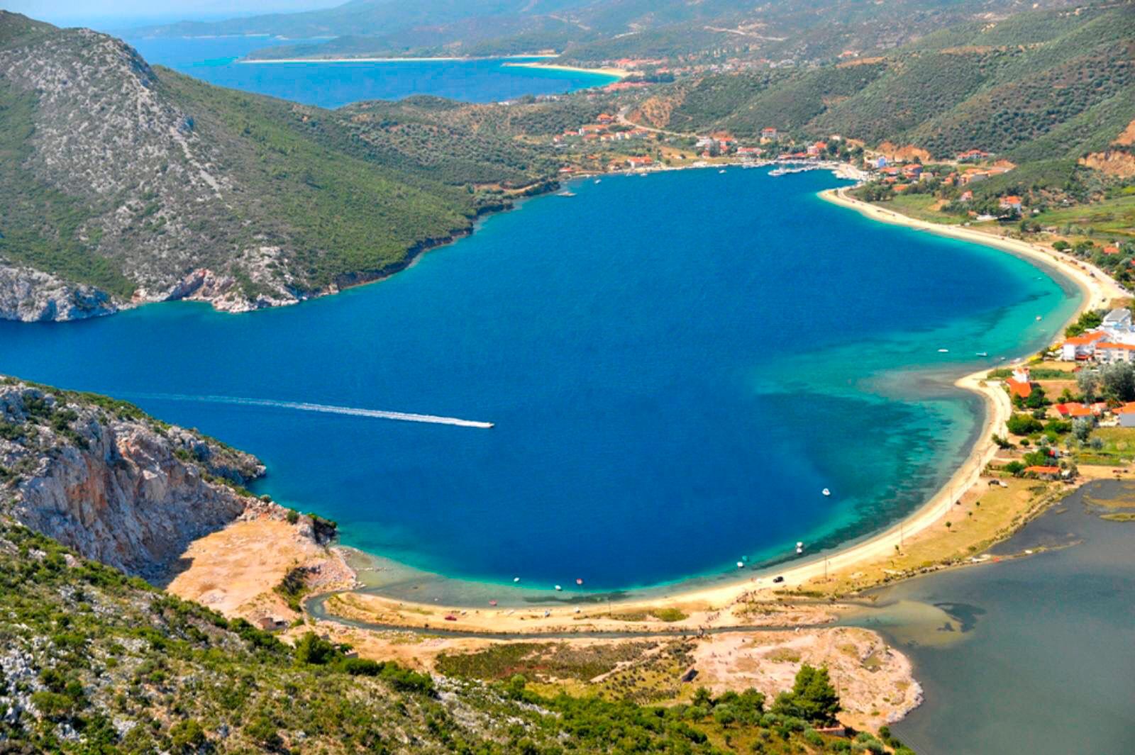 Swimming stops during a Greek island cruise with sea caves and blue waters